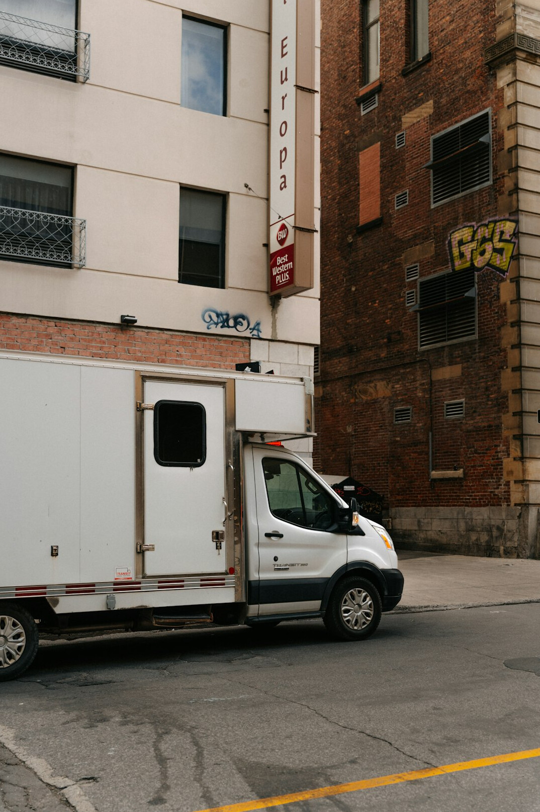 Outside broadcast van with satellite uplink dish parked at a live event